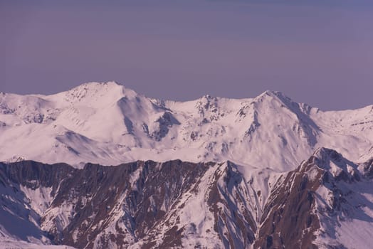 mountain landscape at winter with fresh snow on beautiful sunny day at french alps
