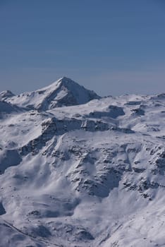 mountain landscape at winter with fresh snow on beautiful sunny day at french alps