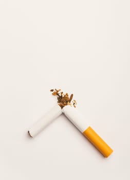 31 May of World No Tobacco Day, no smoking, close up of broken pile cigarette or tobacco STOP symbolic on white background with copy space, and Warning lung health concept