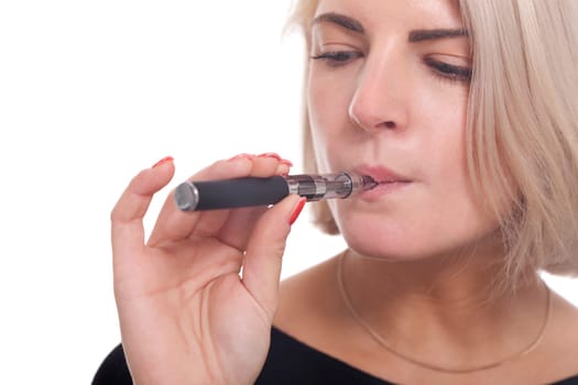 Young woman smokes an e-cigarette with blonde hair portrait isolated against white background