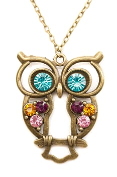 Owl necklace adorned with precious stones. Isolate on white.