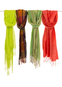 Silk colored scarves on a hanger. Isolate on white