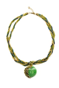Necklace with emerald green stone. Isolate on white.
