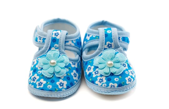 A pair of blue baby shoes. Isolate on white.