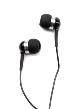 Small in-ear headphones isolated on white background