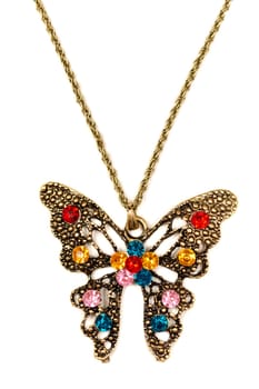 Butterfly pendant decorated with colored stones. Isolated on white.