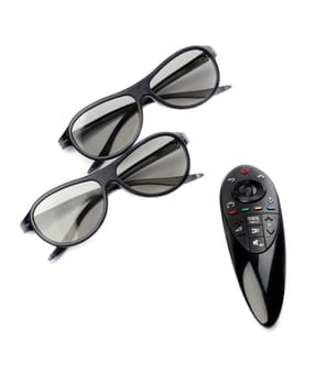 Two pairs of 3D glasses and remote control TV. Isolate on white.