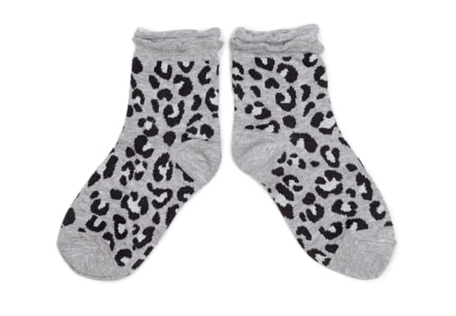Pair of gray socks with black pattern. Isolate on white.