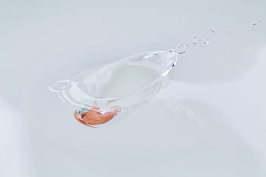 One euro cent coin falling into water