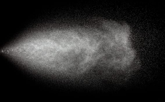 Spraying of water in motion isolate on black background.