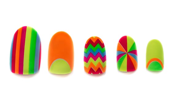 Colored, plastic artificial nails on a white background