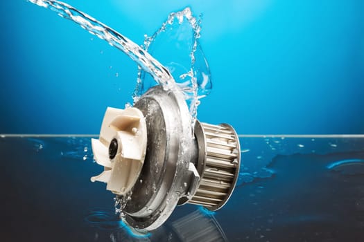 Auto parts, engine cooling pump in water splash on blue gradient background