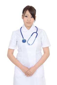 Young asian female nurse with hands crossed