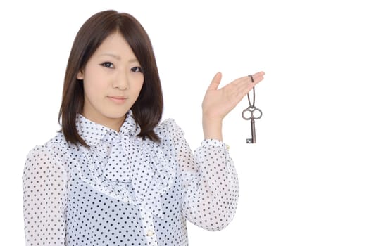 Beautiful young asian woman holding keyring in her hand