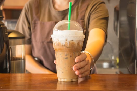 Plastic glass of iced coffee cappuccino