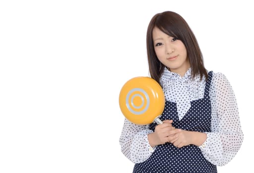 Young asian housewife with frying pan