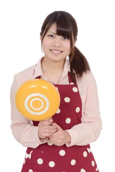 Young asian housewife with frying pan