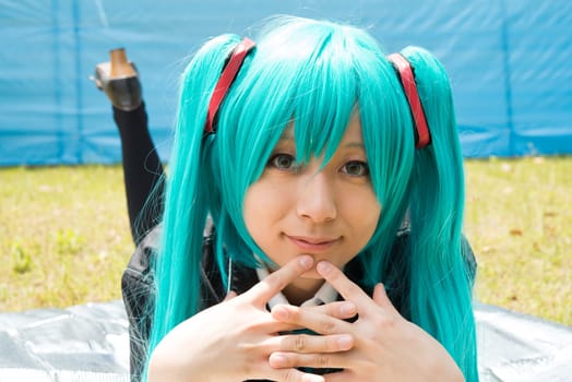 Young japanese girl dressed in cosplay costume
