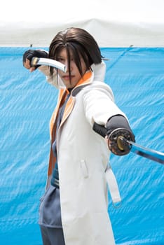 Young japanese man dressed in cosplay costume