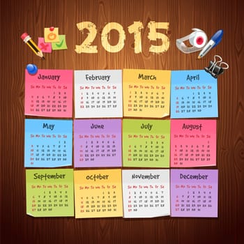 Office Stickers Calendar 2015 calendar on Wooden Background. Clipping paths included in additional jpg format.