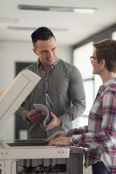 happy business people group at modern office copy  documents on machine