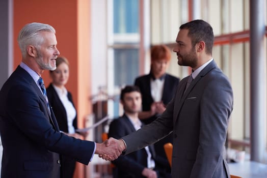 business partners, partnership concept with two businessman handshake