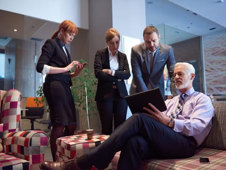 business people group with young adults and senior on meeting at modern bright office interior.