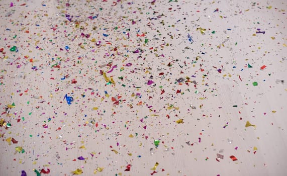 happy young romantic  couple in love  celebrating and blowing confetti decorations at new year and charismas  party