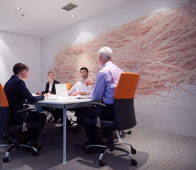 business people group with young adults and senior on meeting at modern bright office interior.