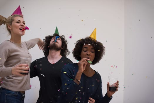 confetti party Multiethnics happy young people group celebrating new year eve while dancing and have fun at home