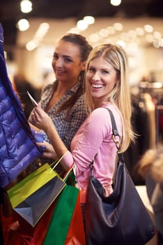happy young girls in  shopping mall, friends having fun together