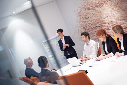 business people group with young adults and senior on meeting at modern bright office interior.