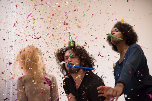 confetti party happy young people group celebrating new year eve while dancing and have fun at home