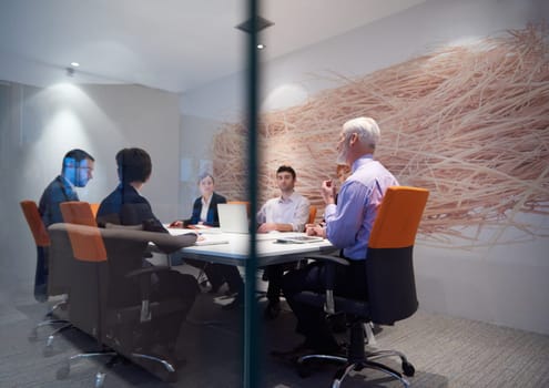 business people group with young adults and senior on meeting at modern bright office interior.