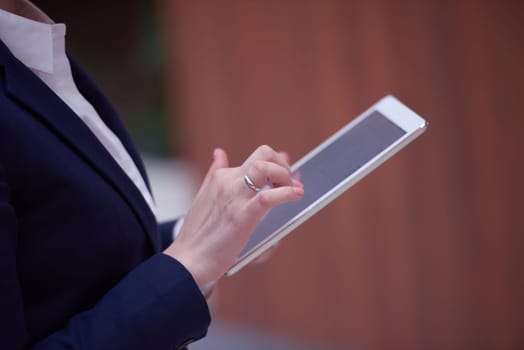 corporate business woman working on tablet computer  at modern office interior