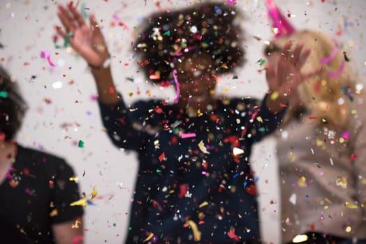 confetti party Multiethnics happy young people group celebrating new year eve while dancing and have fun at home