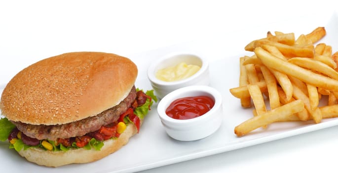 still life with fast food hamburger menu, french fries, soft drink and ketchup
