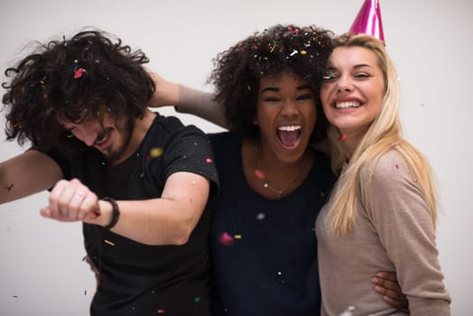 confetti party Multiethnics happy young people group celebrating new year eve while dancing and have fun at home