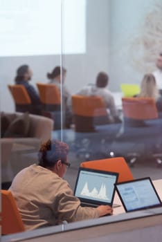 Young female Entrepreneur Freelancer Working Using A Laptop In Coworking space