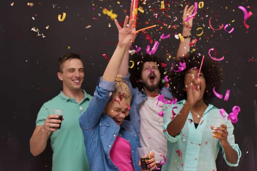 confetti party Multiethnics group of happy young people celebrating new year eve while dancing and have fun at home