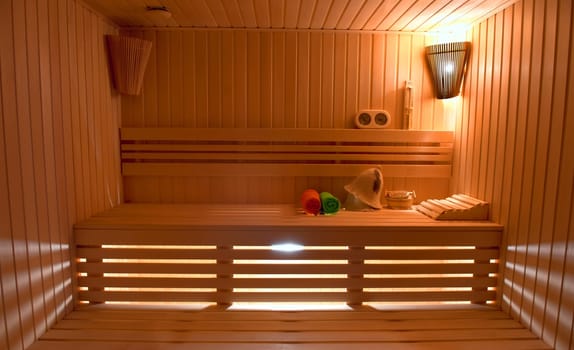 Sauna room with traditional sauna accessories