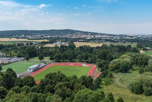 View from Friedberg Castle to a sports facility and the city of Bad Nauheim, Hesse, Germany
