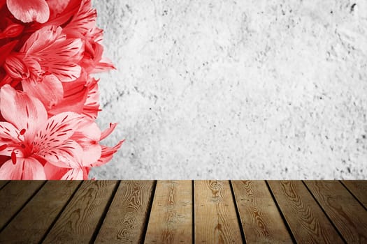 Background flowers on a textured stucco wall and blank wooden planks in the foreground. For product demonstrations, free space, layout, mockup, perspective board, background board.