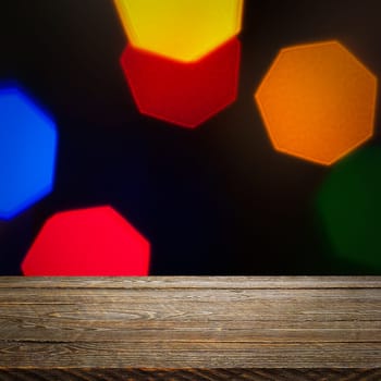 The background is an empty wooden board and a wall of blurred bokeh lights. For product demonstrations, free space, layout, mockup, perspective board, background board.
