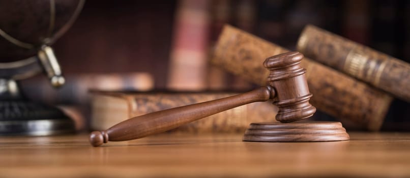 Law and justice concept, Brown wooden background