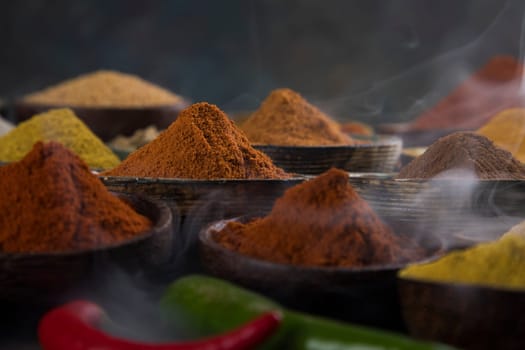 Assorted Spices and wooden bowl of smoke