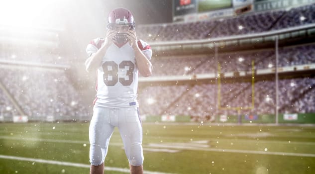 American Football Player isolated on big modern stadium field with lights and flares