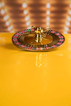 Roulette wheel in motion in a casino background