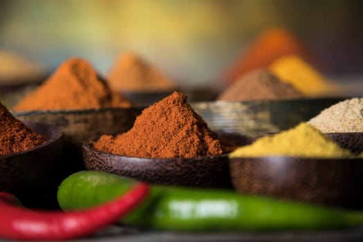 Aromatic spices on wooden background