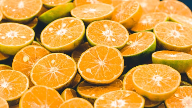Sliced orange background . Colorful orange citrus fruit slices . Half orange fruit , fresh and juicy . healthy food and vitamin C